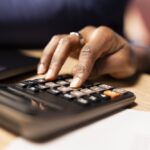black couple managing their self employed business finances and taxes
